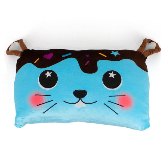 Bitty the Bunny Sleep Pillow is a cuddly, rectangular pillow with blue and brown colors, embroidered whiskers, starry eyes, pink cheeks, two small brown ears, and sprinkle-like decorations on top.