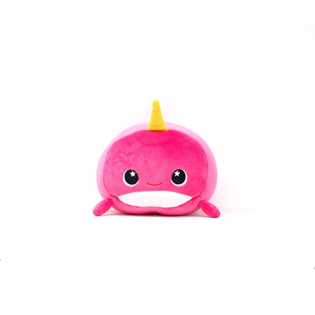 Introducing Bubblegum the Narwhal 2-In-1 Travel Pillow, an award-winning plush toy with a pink body, a yellow horn, a smiling face, large starry eyes, and two small flippers. It's perfect for cuddles or as a cozy travel pillow against plain white backgrounds.
