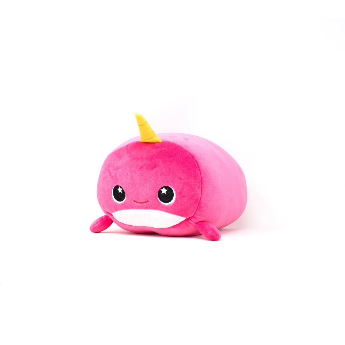 Introducing Bubblegum the Narwhal 2-In-1 Travel Pillow, an award-winning plush toy with a soft pink hue and cheerful yellow horn. This adorable companion is perfect for cuddles and adventures, doubling as a comfy travel pillow against a crisp white background.