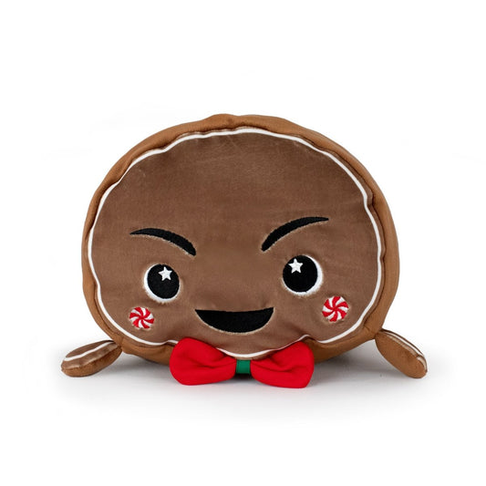 Clovis the Gingerbread Man is a plush pillow shaped like a smiling gingerbread cookie, featuring rosy cheeks, starry eyes, a red bow tie, and white icing details. This adorable, soft toy is also machine washable for easy care.