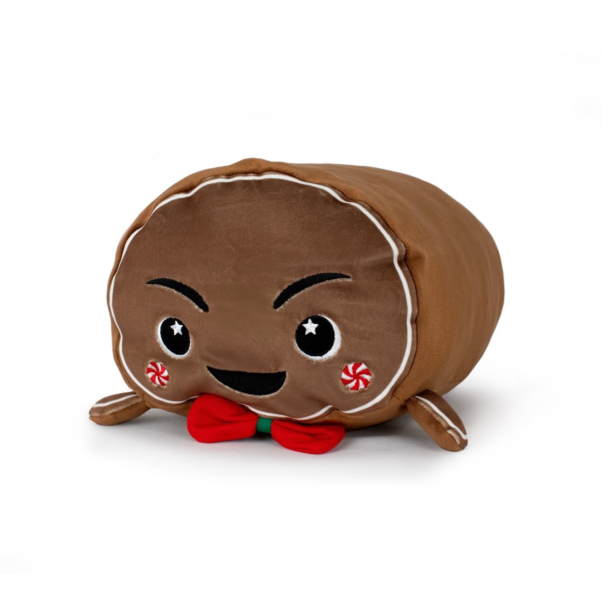 Clovis the Gingerbread Man is a plush toy shaped like a smiling gingerbread cookie, featuring embroidered details, red peppermint cheeks, and a red bowtie. Soft and machine washable, it's perfect for cuddles and easy care. Shown on a white background.