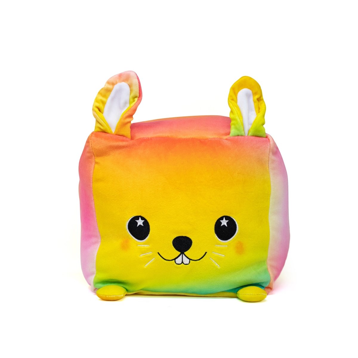 Meet Coco the Bunny Plushie: a cube-shaped plush toy with a gradient of orange, pink, yellow, and green. It has charming bunny ears, a cute face with starry eyes, a smiling mouth, and small feet—a soft and cheerful stuffed plush that's irresistibly adorable.