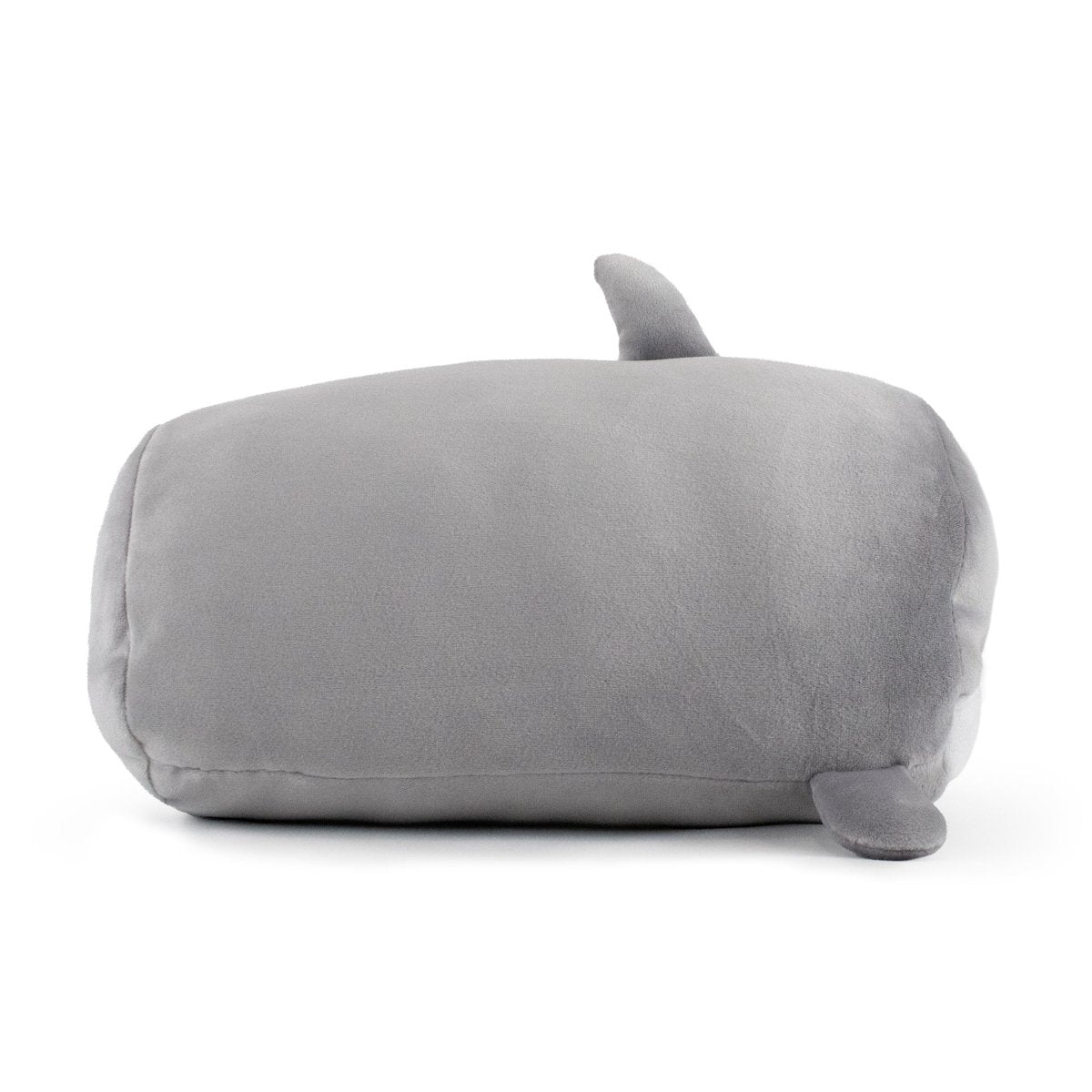 Crush the Gray Shark Plushie is a rectangular, soft, gray pillow with a simplified shark shape. It features a small dorsal fin on top and a tail fin at the back, boasting smooth texture and minimalist design.