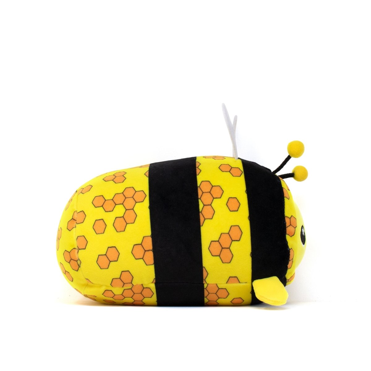 The Vee Slumber Plushie, a cute bee toy and animal pillow, features a round yellow body with black stripes and orange hexagon patterns. It has small wings and black antennae with yellow tips, making it the perfect soft and squishy companion!.