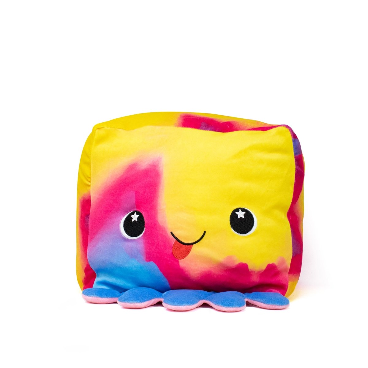 The Eve the Octopus Plushie is a square-shaped toy with a vibrant yellow, pink, and blue tie-dye pattern. It features a cute smiling face, large eyes with star highlights, and a small tongue sticking out. Its sensory softness is enhanced by the blue ruffled base suggesting legs.