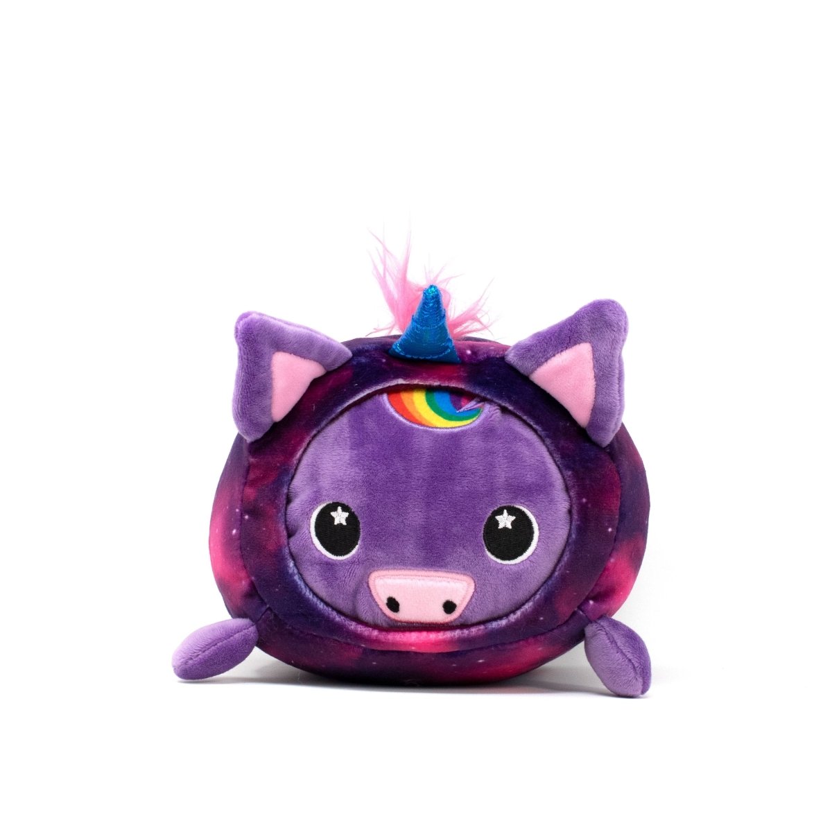 The Twinkle Slumber Plushie is a round, galaxy-patterned unicorn toy with starry eyes and a pig-like nose. It has purple ears, pink tufted hair, and a rainbow detail on its forehead.