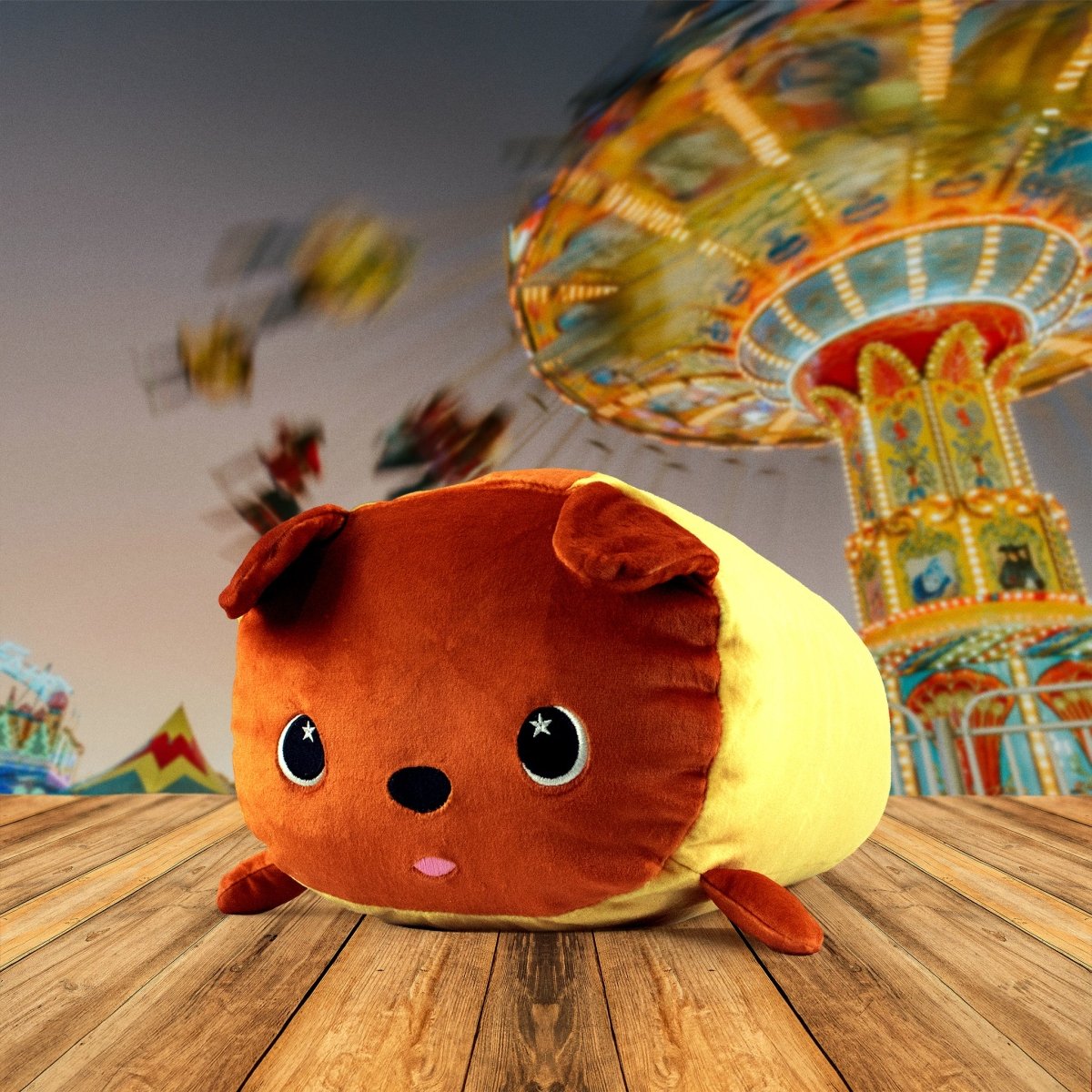Gilbert the Hotdog Plushie, soft and cute like a round dog, rests on a wooden floor. In the background, a colorful amusement park ride blurs with motion and excitement.