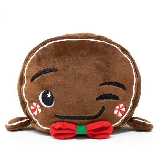 Gingersnaps the Gingerbread Plushie is a soft pillow with embroidered winking eyes, peppermint cheeks, a red and green bow tie, and icing details—perfect for holiday plushie fans.