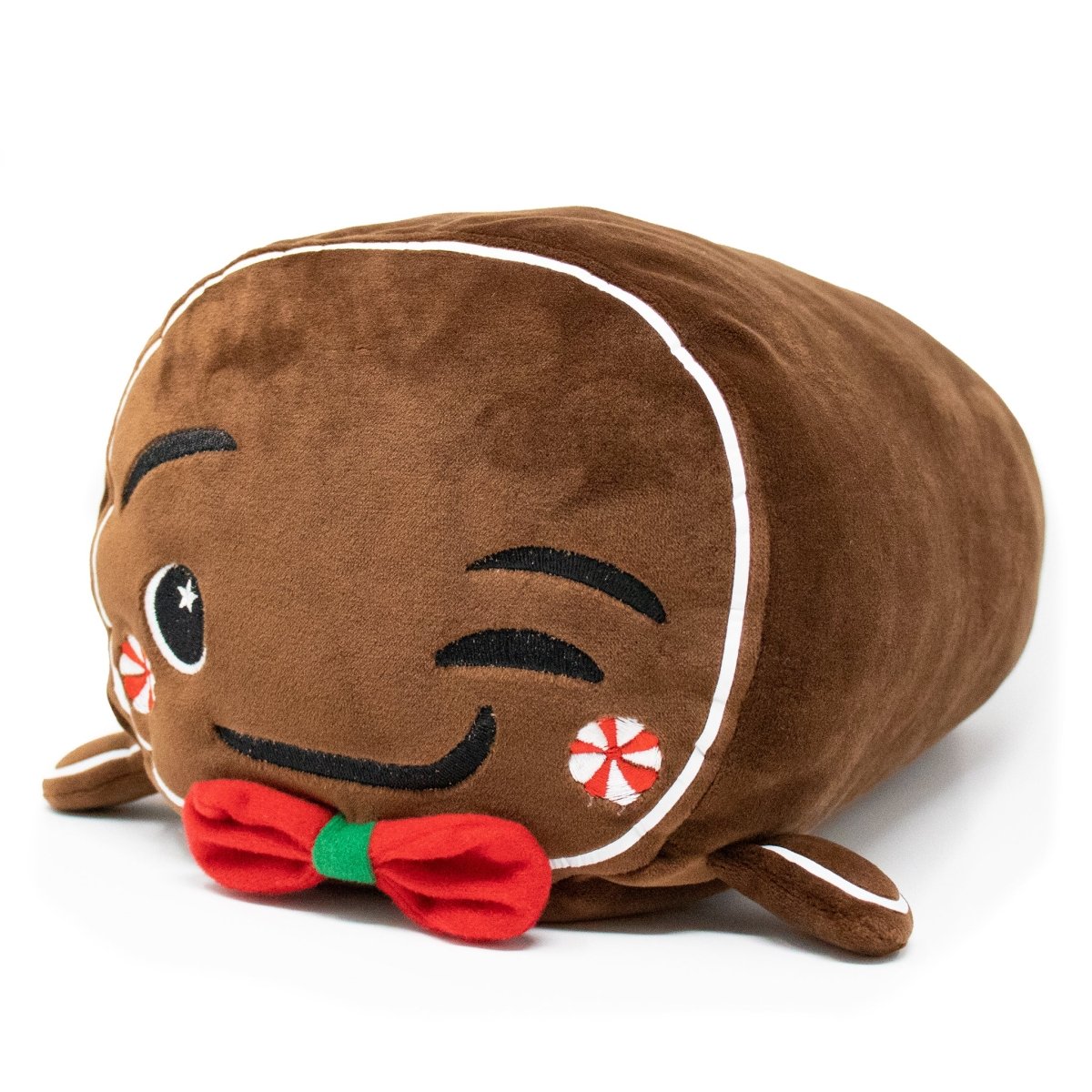 Gingersnaps the Gingerbread Plushie is a cute, cookie-shaped plush with a winking face, smiling mouth, red bow tie, candy-decorated cheeks, and embroidered details on soft brown fabric—perfect for the holidays.
