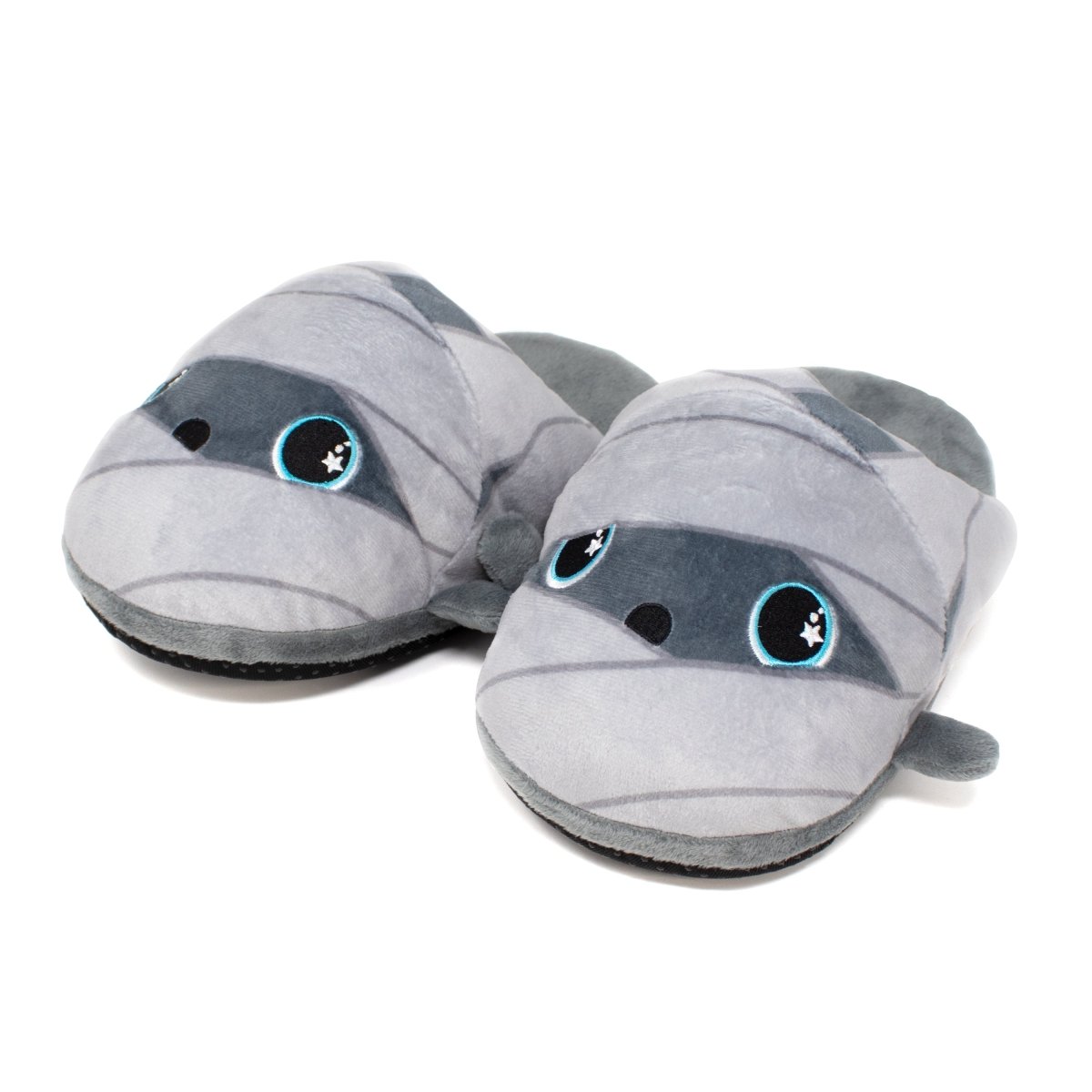 Nile the Mummy Halloween Slippers are gray, mummy-themed plush footwear with large cartoon-like eyes and wrapped bandage designs, perfect for adding fun to your lounging experience.