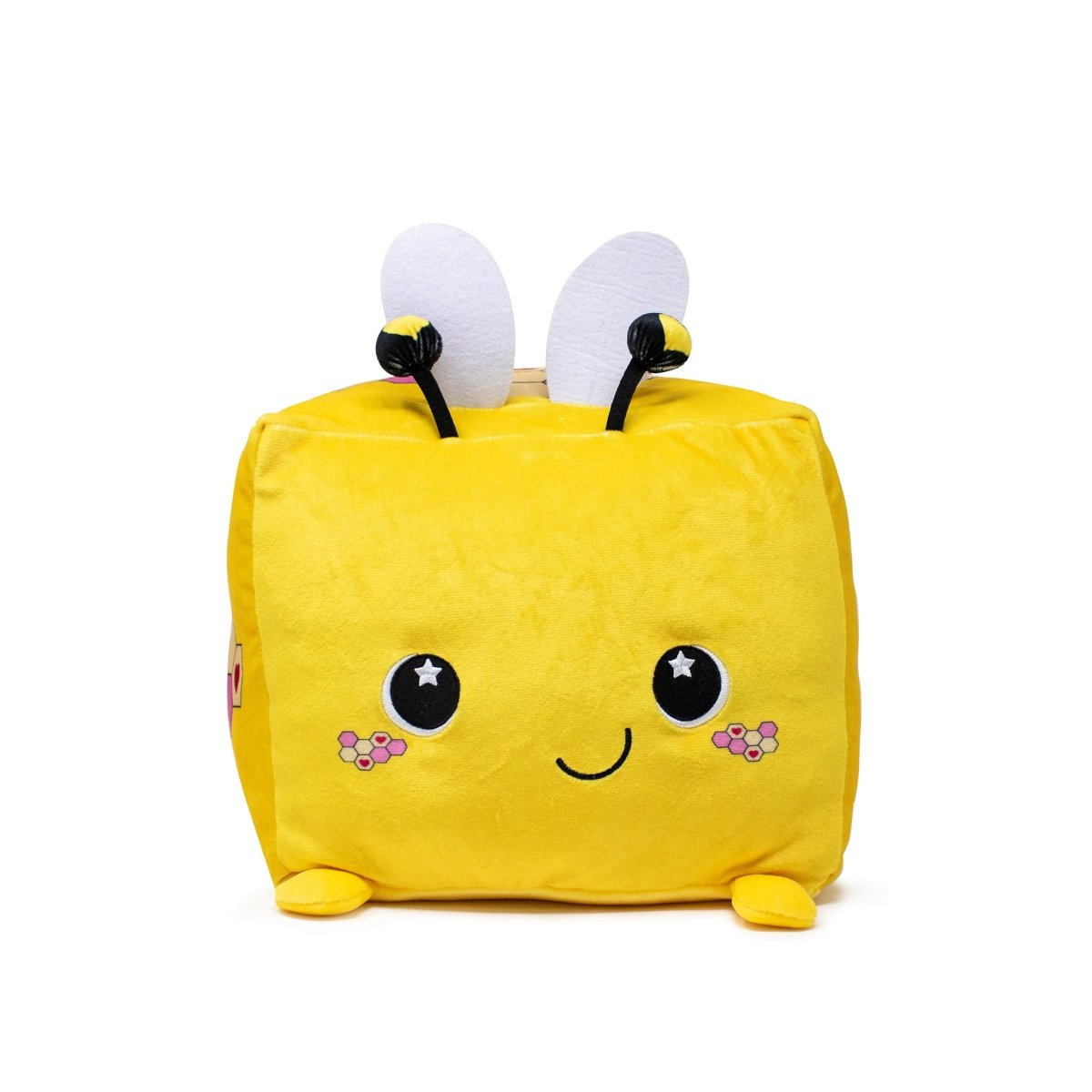 This Hex the Bee Plushie is a cube-shaped toy featuring a vibrant yellow color, a smiling face, rosy cheeks, and star-detailed eyes. It sports small white wings with black edges—a must-have for plushie fans who love honey-making vibes.