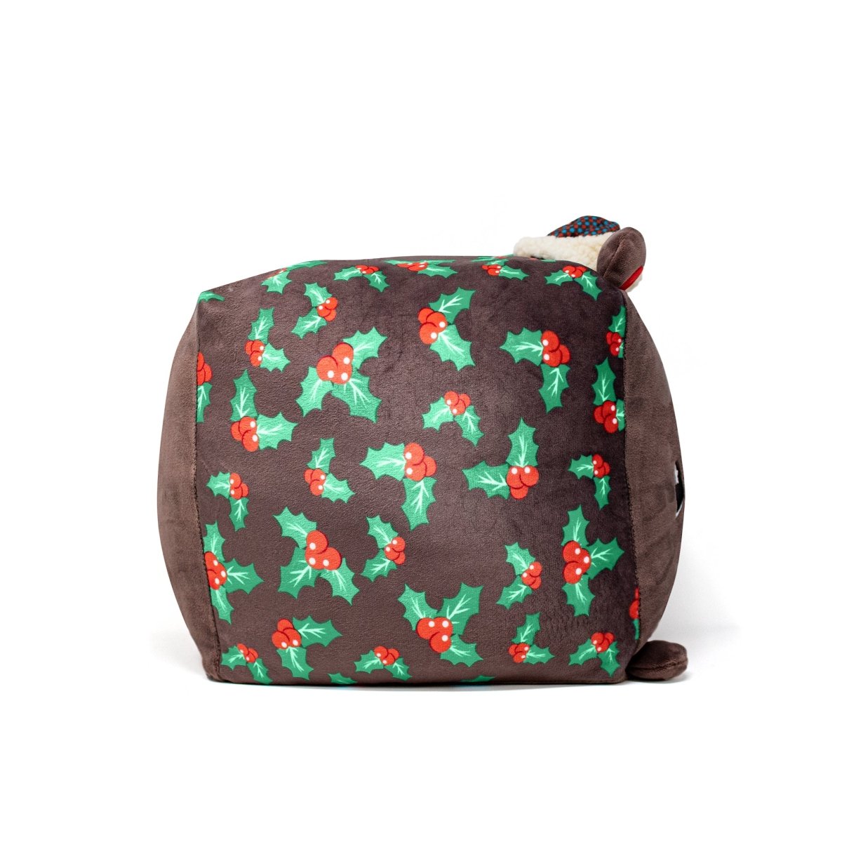 The Holly Plushie is a soft, square stuffed animal with a festive Christmas holly pattern of green leaves and red berries. It features brown sides and an ear-like detail on top, making it perfect for the holiday season.