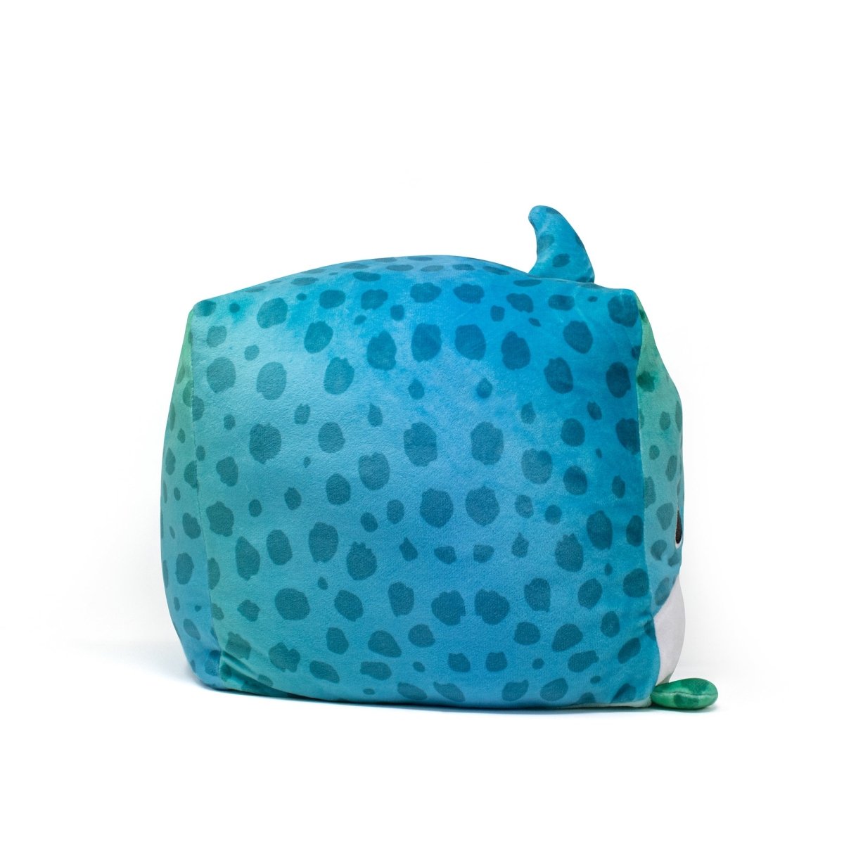 Houdeenie the Leopard Shark Plushie, with a round and delightful design, showcases blue and teal spotted patterns and a small top fin. Its soft sensory feel is perfect for snuggles, enhanced by a charming white underbelly. Machine washable, it's an ideal companion for easy care.
