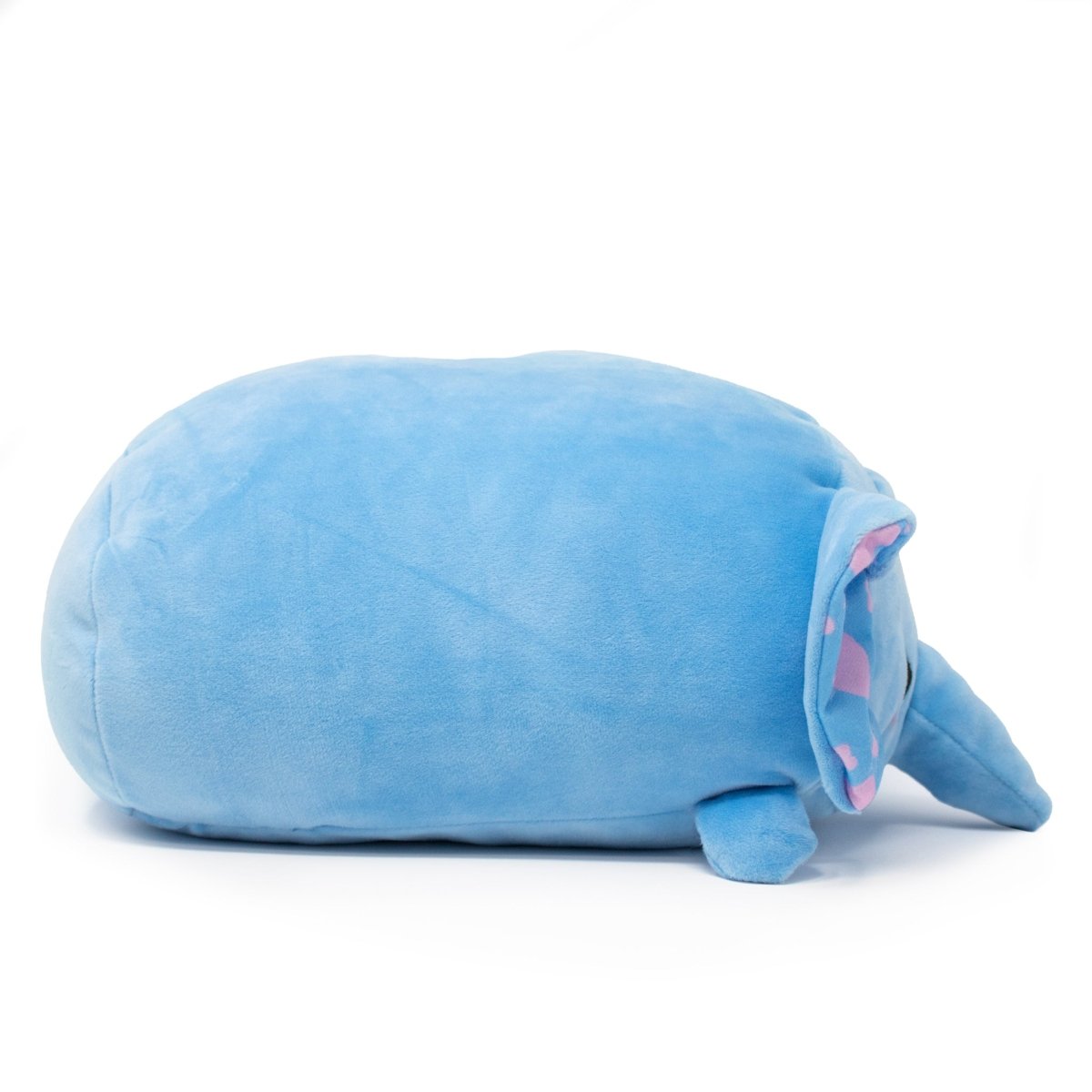 Meet Itsy the Elephant Plushie, a soft and squeezable blue elephant with a round body, small legs, and an elongated trunk. Its ears boast a charming pink and blue pattern inside against a plain white background.