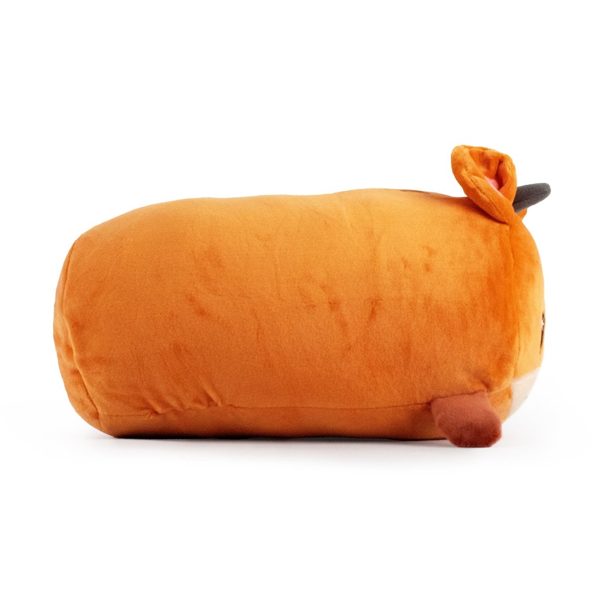 This plush, named Jerry the Giraffe, is a cuddly orange cartoon animal with small ears and a black spot on top. The cylindrical stuffed toy lies on its side against a plain white background.