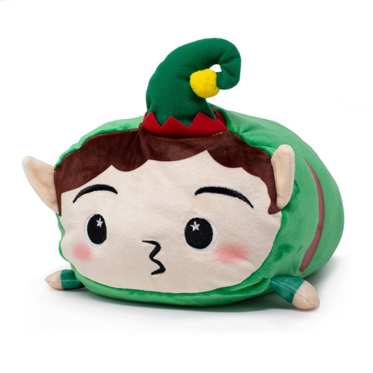 Jingle the Elf Plushie is a festive holiday plush shaped like an elf, featuring pointed ears, rosy cheeks, brown hair, a green hat with a yellow pom-pom, and a green outfit. It lies on its belly with a surprised expression.