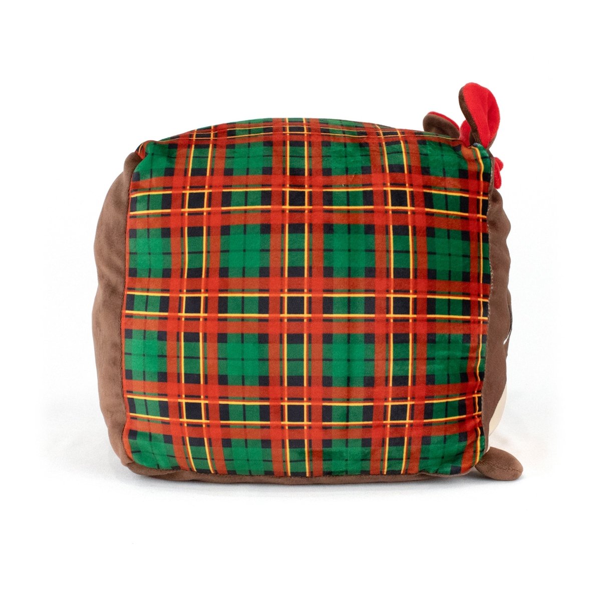 Joy the Otter is a soft square plush pillow featuring a red, green, and yellow plaid front, brown sides, a small tail at the bottom, and red antlers—perfect for fans of cuddly stuffed plushies.