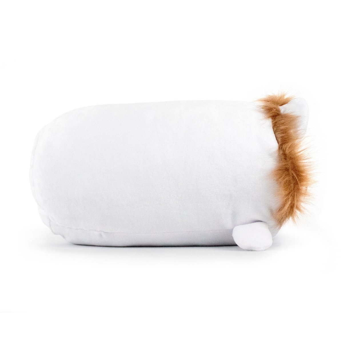 A fluffy, white, oval-shaped plush from the Cuddly Cuties collection, King Leo the Lion Plushie, rests on its side against a plain white background. It has small round feet and a bushy brown tail tuft at one end, made from ultra-soft materials for maximum coziness.