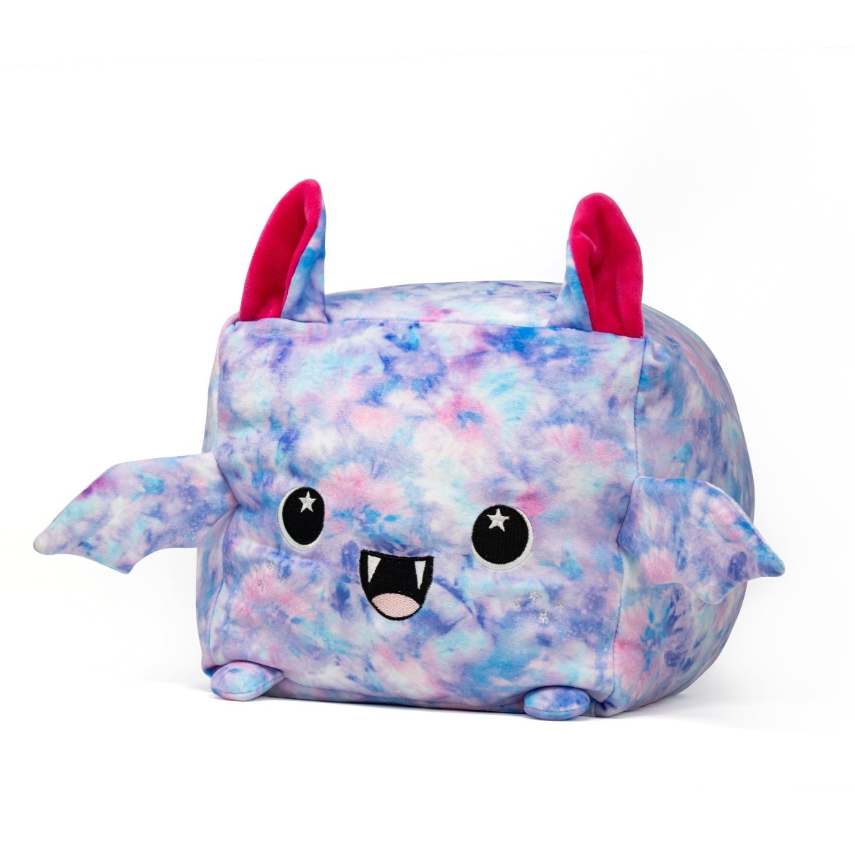 The Lyra the Bat Plushie is a square-shaped toy with a blue and pink tie-dye pattern. It features big eyes, a cute smile with small fangs, two ears, and tiny side wings. This adorable plush will bring joy to everyone it meets.