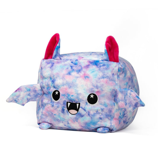 The Lyra the Bat Plushie is a square-shaped toy with a blue and pink tie-dye pattern. It features big eyes, a cute smile with small fangs, two ears, and tiny side wings. This adorable plush will bring joy to everyone it meets.