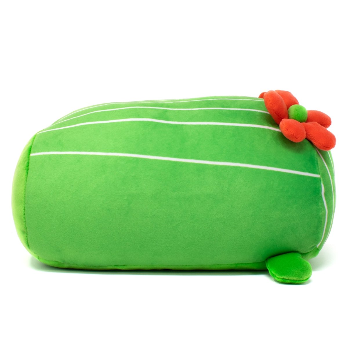 The large, machine-washable Maya the Cactus Plushie is a squishy pillow shaped like a cactus, adorned with horizontal white lines, a small red-orange flower on top, and a tiny green leaf at the base.