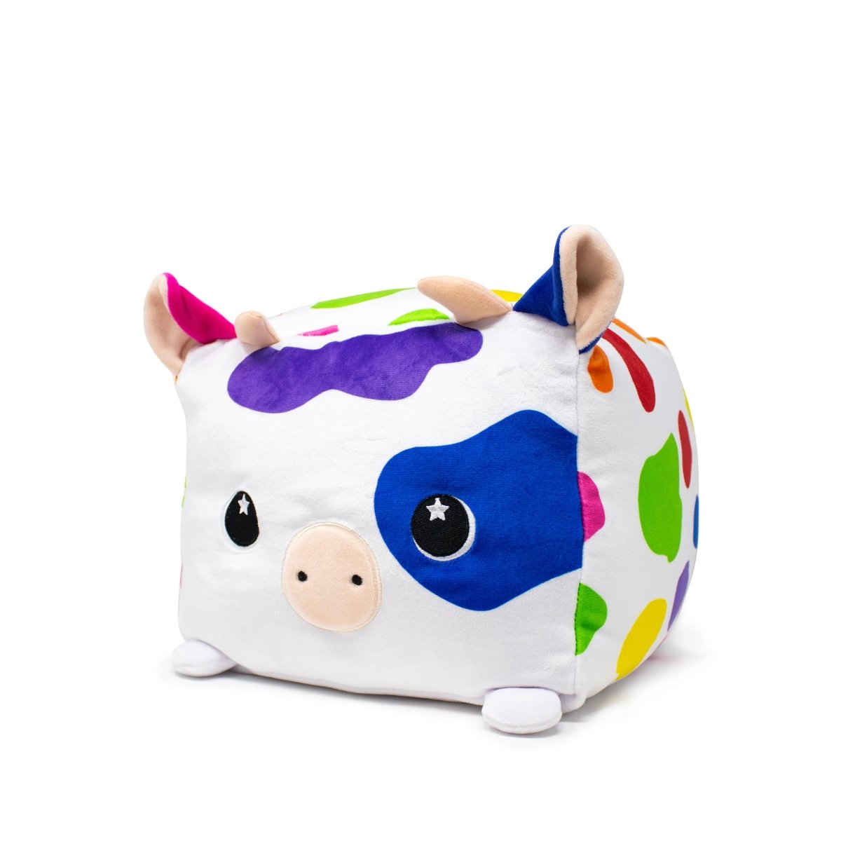 Meet the Moosh-Moosh SQUARED² plush toy: Milly the Cow! This cute cube features a white body with blue, green, red, and purple spots, a light pink snout, starry black eyes, and small beige ears—ideal for plushie enthusiasts!.