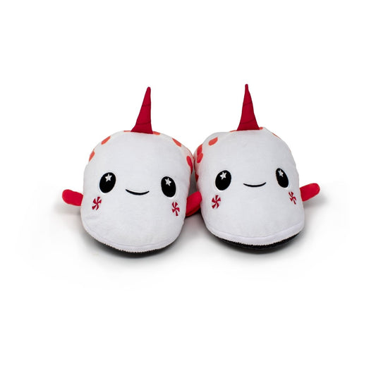 A pair of Mintie the Mint Slippers—plush white holiday slippers shaped like adorable narwhals with red horns, smiling faces, and starry black eyes—set against a plain white background.