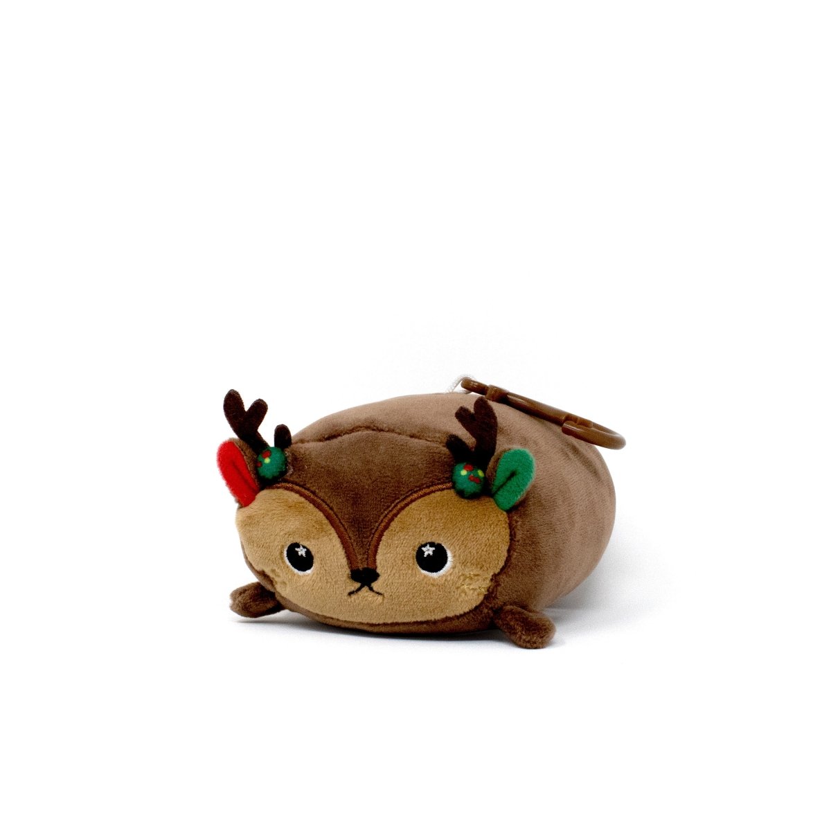 Meet Mitzy the Reindeer Clip-On, a plush keychain with antlers, red and green ear accents, and a round body. The ring attaches at the back—ideal for bags or keys. Shown against a plain white background.
