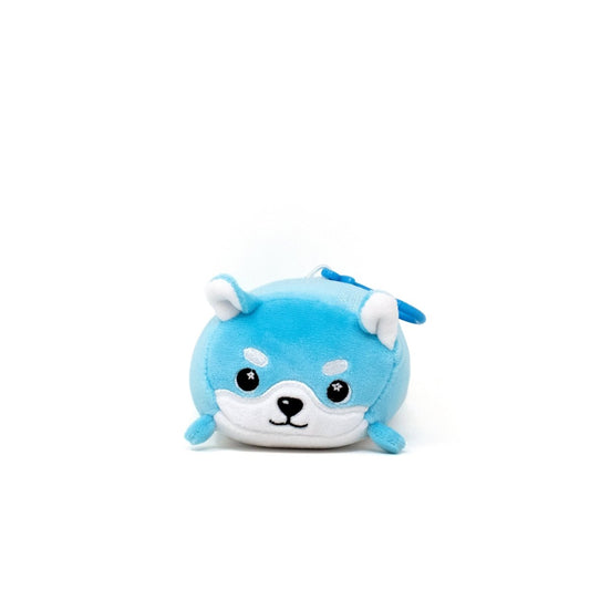 Yuki the Snow Fox Clip-On is a cute blue and white stuffed animal with small ears, a happy face, and a tail on a plain white background.
