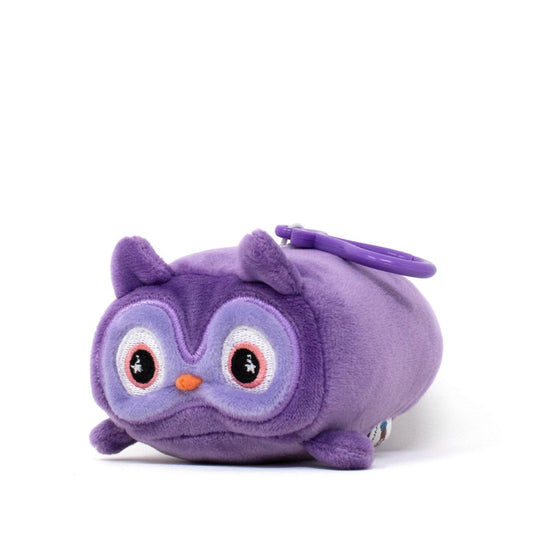 Archie the Owl Clip-On is a small, purple plush toy with oversized eyes, a tiny orange nose, and purple ears. Shaped like a capsule, it features soft fabric and includes a purple plastic clip for easy hanging or attachment.