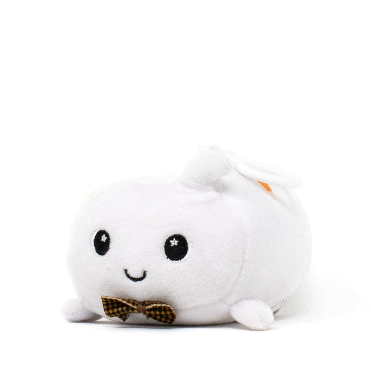 Boo the Ghost Clip-On is a small, white plush toy with starry eyes and a smiling face. It features tiny limbs and a cute brown checkered bowtie around its neck, sitting charmingly against a plain white background.