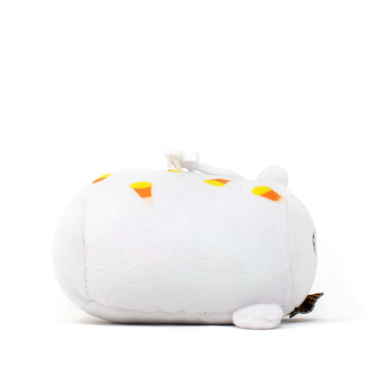 A Boo the Ghost Clip-On, a plush toy shaped like a round white cat with small orange triangle patterns resembling candy corn, has tiny ears and a small tail. It rests on a plain white background.