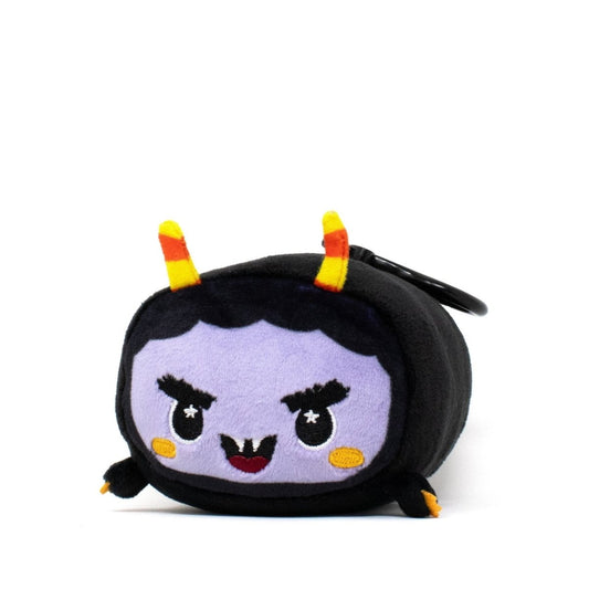 Fang the Monster Clip-On is a small, square plush from the Moosh-Moosh Spooky Series with a light purple face, black hair, yellow-and-orange striped horns, tiny arms, a mischievous smile, and a black clip on its back.