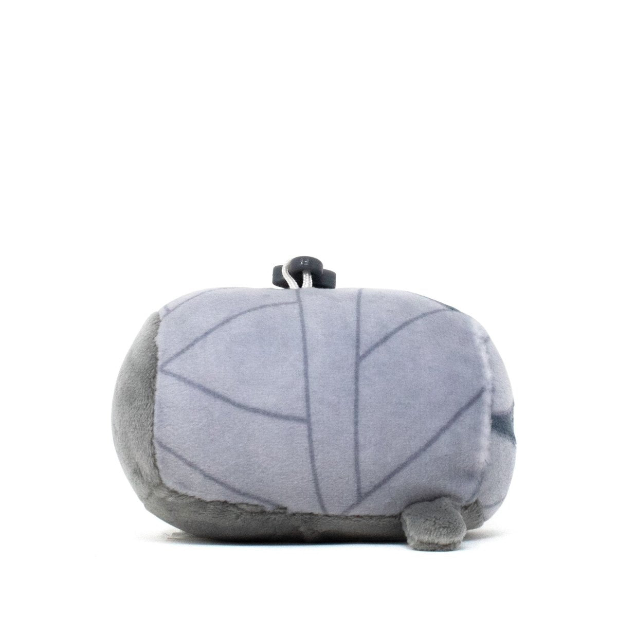 The Nile the Mummy Clip-On plushie is shaped like a gray stone with leaf-like patterns and a small knob on top, with a round form, an incredibly soft texture, and tiny legs at the bottom.