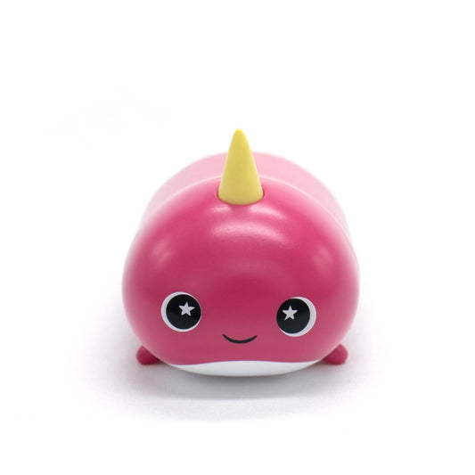 The adorable Bubblegum the Narwhal Vinyl Collectible Figurine features a cartoonish pink narwhal with a small yellow horn, starry eyes, a smiling face, and a rounded shape against a white background.