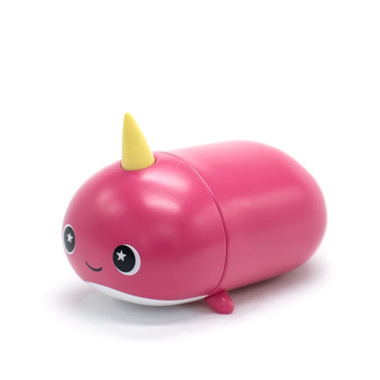 Bubblegum the Narwhal Vinyl Collectible Figurine is a pink, oval-shaped collectible with a yellow horn, big starry eyes, a small smile, and tiny fins—perfect for fans of cute narwhal collectibles.