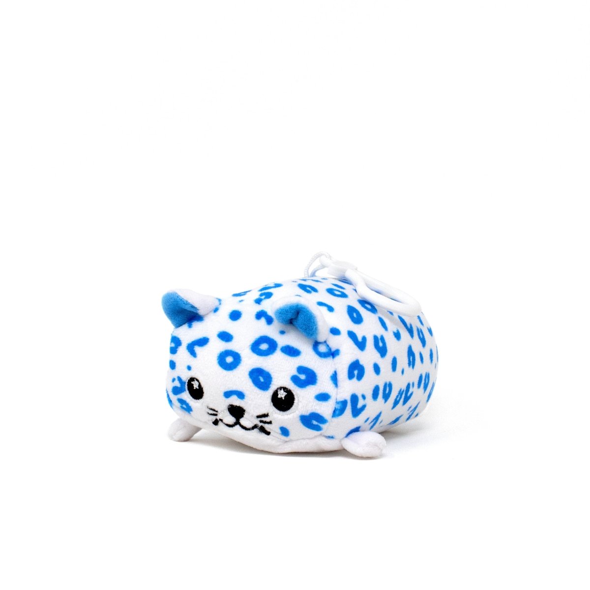 Snowie the Snow Leopard Clip-On is a small plush keychain with blue spots, blue ears, a smiling face, black eyes, stitched nose and mouth on a white background—perfect for decorating bags or backpacks this holiday season.
