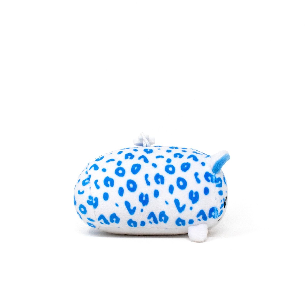 Snowie the Snow Leopard Clip-On is a small, oval plush with white fabric, bright blue spots, tiny ears, and a short tail. This cute cartoon-style animal is perfect as a plush keychain and is shown on a plain white background.