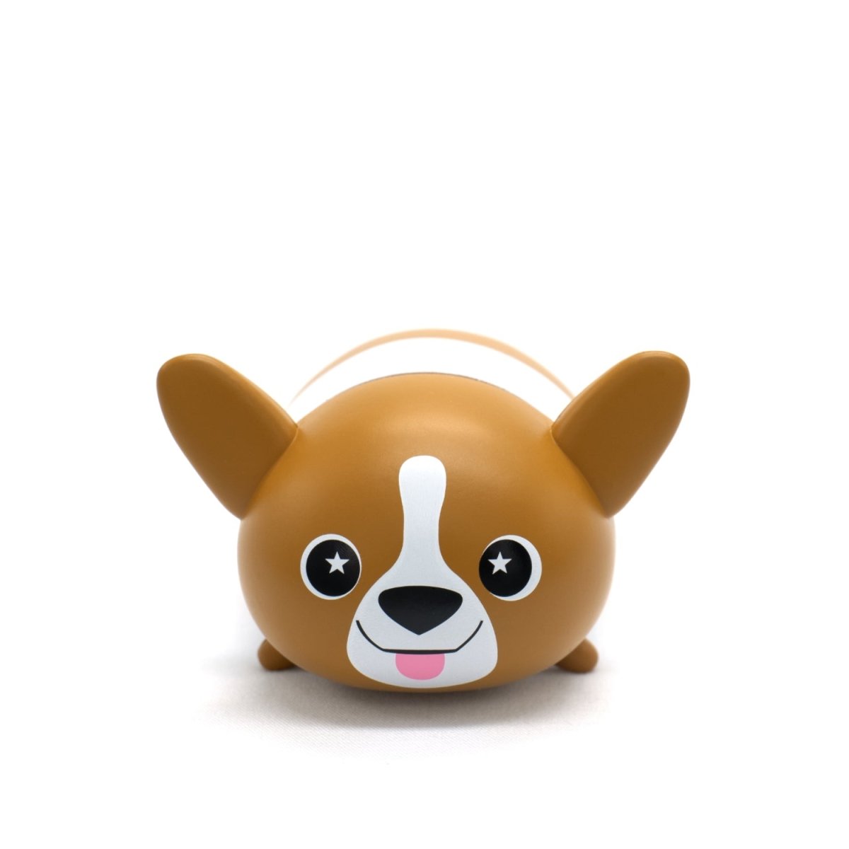 Corey the Puppy Vinyl Collectible Figurine features a round, cartoon-like brown dog with large ears, star-shaped eyes, a white snout, and its tongue out, sitting against a plain white background.
