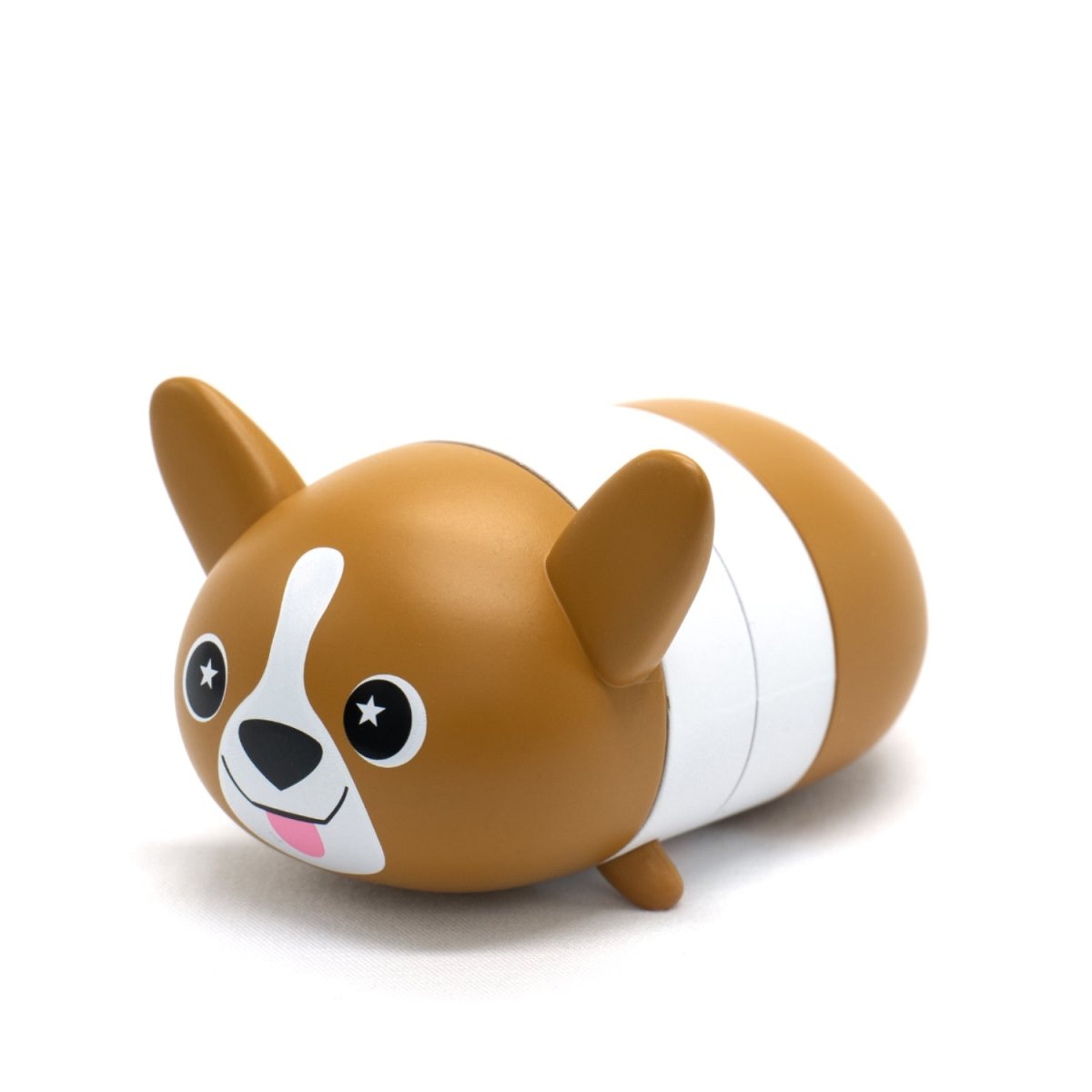 Meet Corey the Puppy Vinyl Collectible Figurine—a cute, cartoonish corgi with big eyes, a white stripe on its face, large ears, and a rounded brown-and-white body with a happy expression and tongue out.