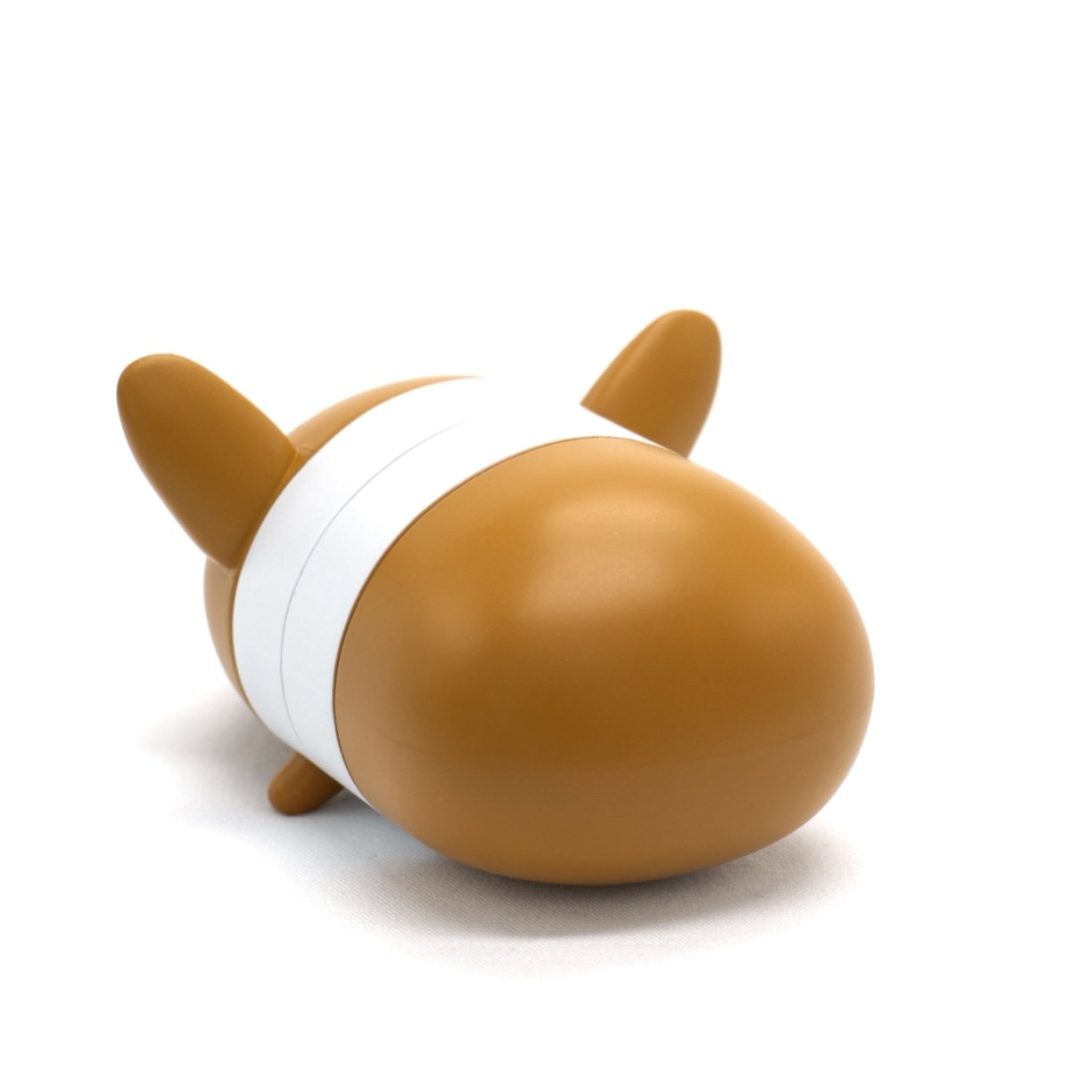 Corey the Puppy Vinyl Collectible Figurine—brown and white with two ears and a white band—resembles a corgi's back. This collectible is photographed on a plain white background.