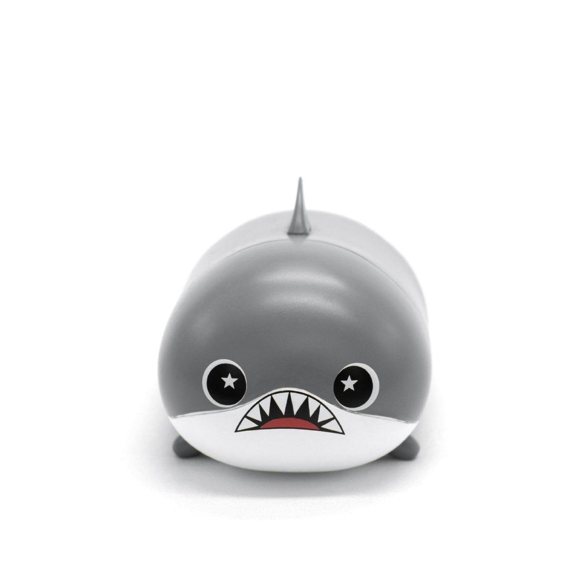 Crush the Shark Vinyl Collectible Figurine features a cute plushie shark with a round body, starry eyes, and an open mouth displaying small sharp teeth against a plain white background.