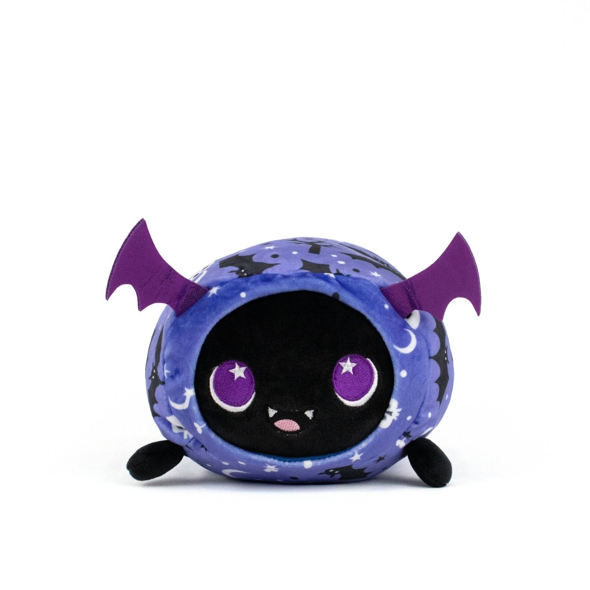 Cassie Spooky Slumber Plushie is a round, ultra-soft bat toy with purple wings, big purple eyes, a small smiling mouth, and a starry blue and black body, pictured against a plain white background.
