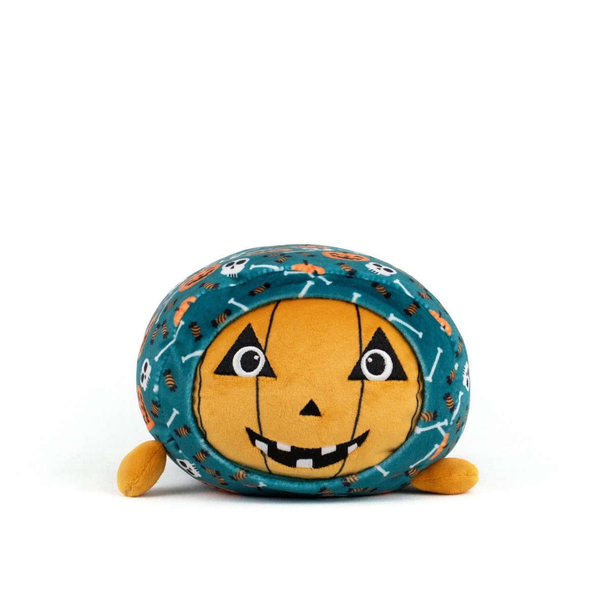 The Vincent Spooky Slumber Plushie is a round, ultra-soft plush with an orange jack-o'-lantern face, black eyes and mouth, small orange feet, and teal fabric patterned with skulls, bones, and spiders.