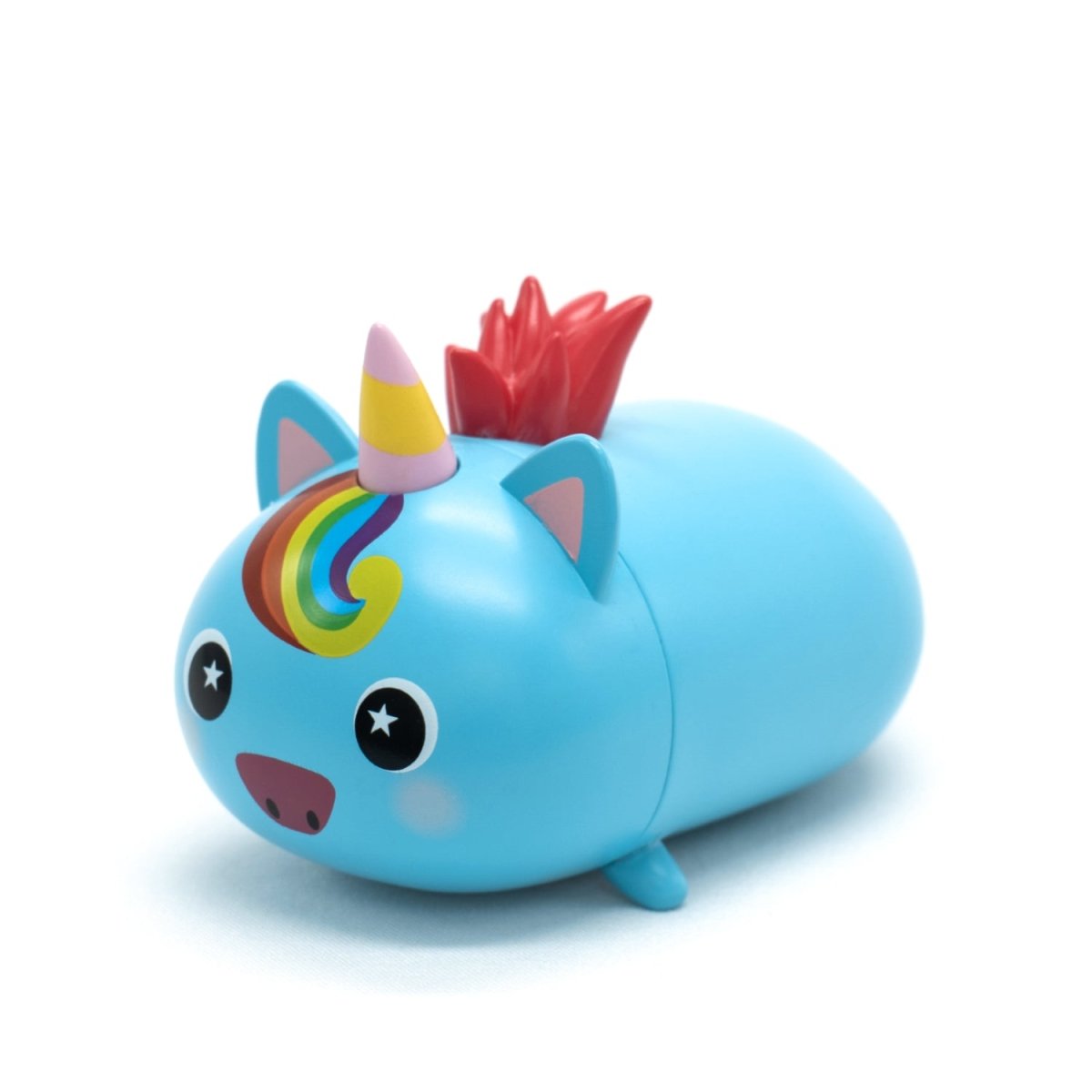 Sparkle the Unicorn Vinyl Collectible Figurine is a small, blue, round animal with a unicorn horn, rainbow mane, red spiked tail, pointy ears, and starry big eyes, displayed against a white background.