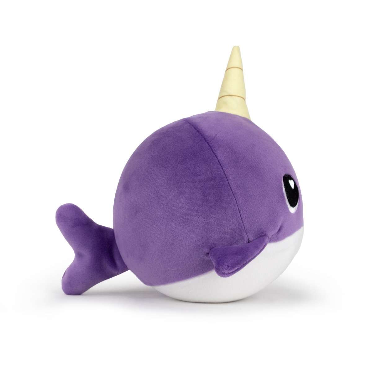 The Jumbo Plushy Skwishy BonBon is a round, purple plush toy that looks like a narwhal with a yellow horn, large black eyes, and small fins. Displayed against a plain white background.
