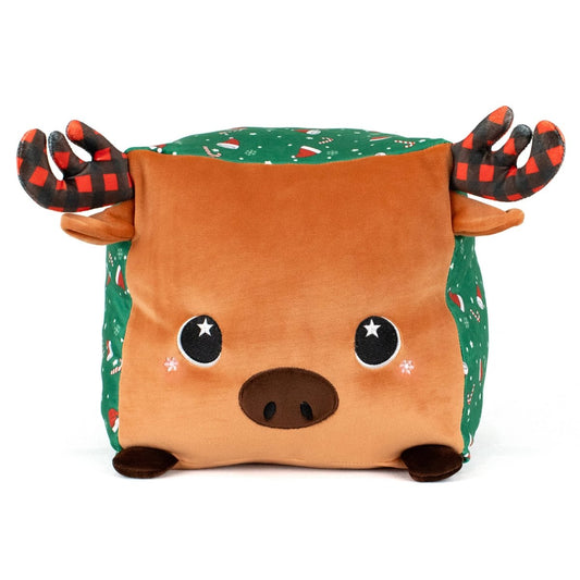 Noel the Moose is a plush, square pillow with a brown face, black nose, starry eyes, rosy cheeks, red-and-black plaid antlers, and green sides adorned with holiday candy cane and Christmas decoration patterns.