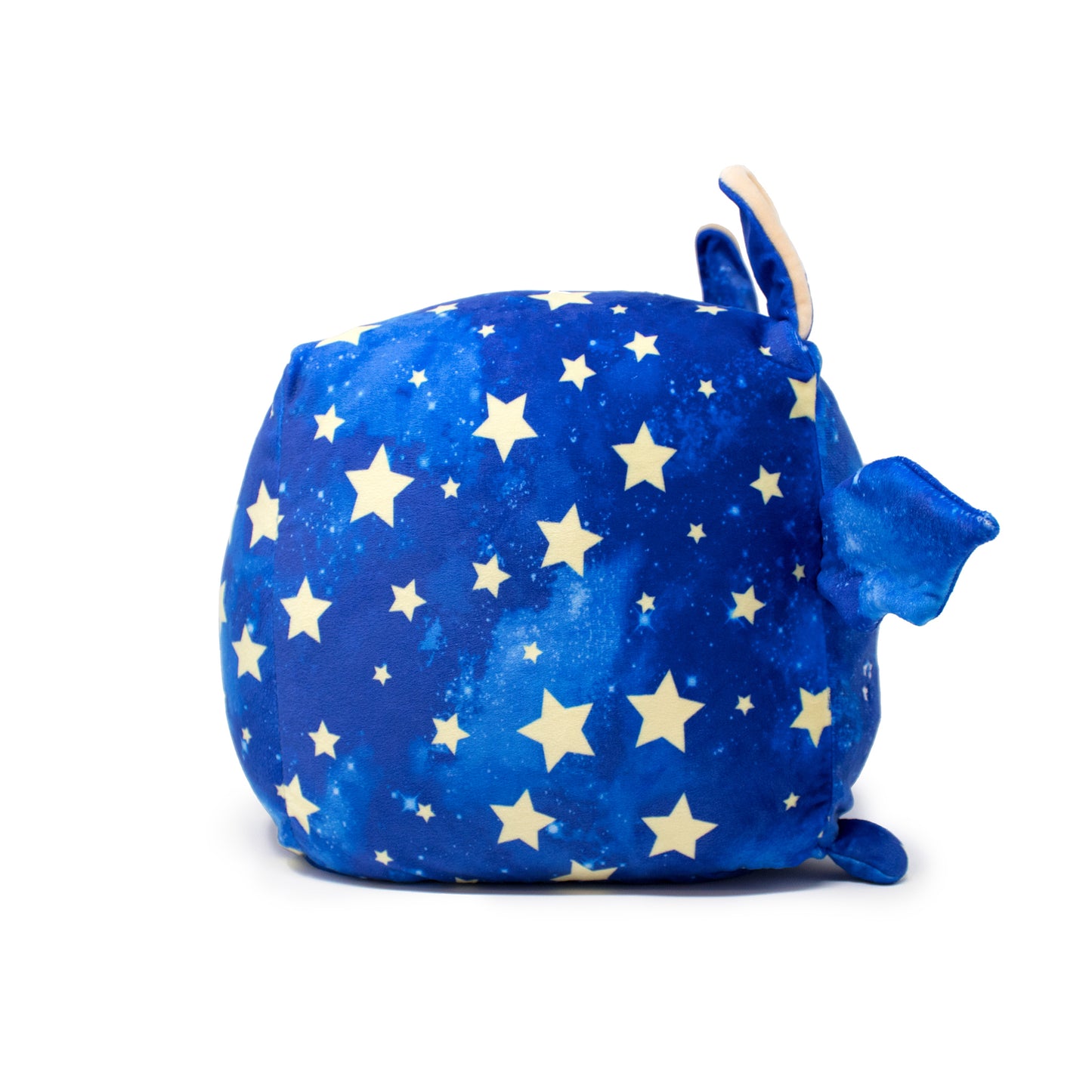 Orion the Bat Plushie is a cube-shaped celestial stuffed animal with a blue surface, white stars, ears, flippers, and a tail set against a plain white background.