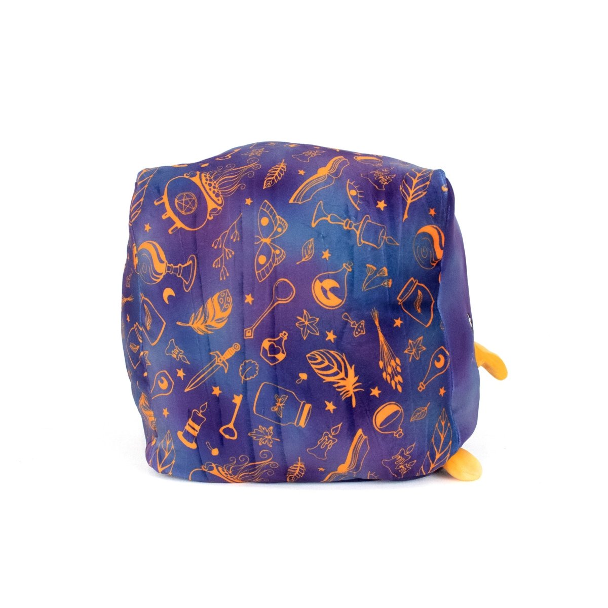 Paul the Black Bird is a soft, cube-shaped plush with a blue and purple backdrop, adorned with orange magical items like keys, feathers, and stars. Two small yellow plush feet appear at the bottom right.