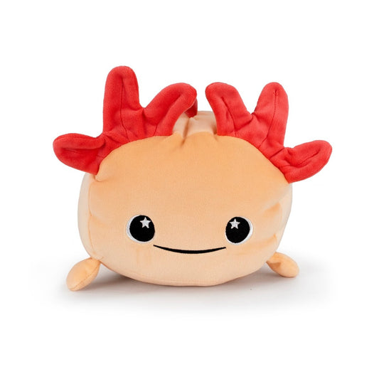 Pearl the Axolotl is a plush toy with a round peach-colored body, smiling face, small legs, and bright red fluffy gills on its head.